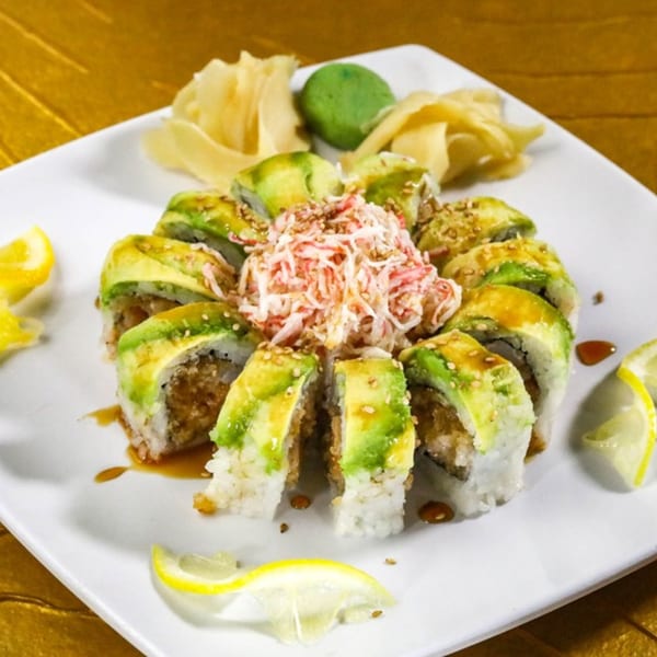 Jazmine's sushi platter with avocado rolls, crab salad, ginger, wasabi, and lemon slices.